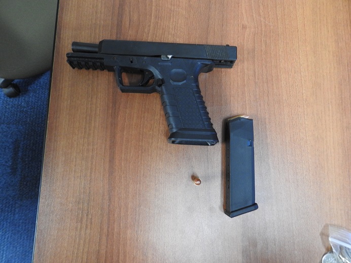 Officer assaulted, handgun and pills seized from accused 